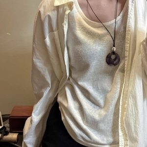 Minimalist S925 silver necklace with purple ring pendant and black cord on model