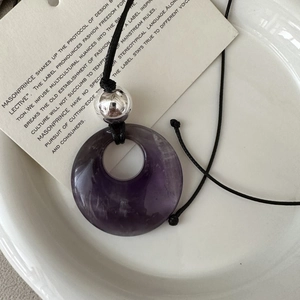 Minimalist S925 silver necklace with purple ring stone and metallic bead on a black cord