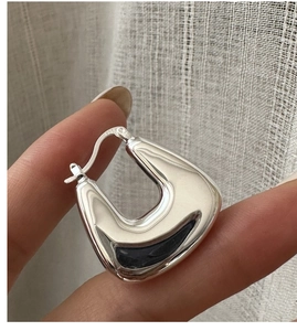 Detail view of S925 sterling silver square hoop earring with high polish finish