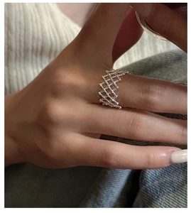 Close-up of S925 sterling silver lattice ring with a unique mesh design on finger