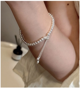 Detail of adjustable S925 sterling silver beaded bracelet on wrist with pull closure