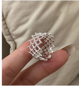 Close-up of S925 sterling silver mesh ring with a hollow beaded design and open-end style