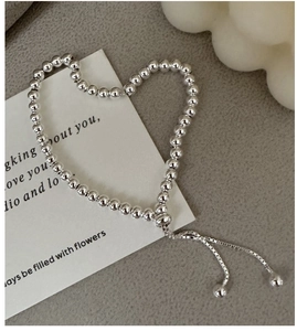 Detailed view of S925 sterling silver beaded bracelet with adjustable pull chain clasp