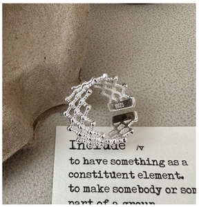 Detail view of S925 sterling silver mesh ring with visible S925 hallmark on inner band