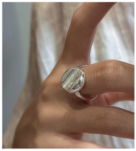 Detailed view of S925 sterling silver ring with brushed disk and polished finish