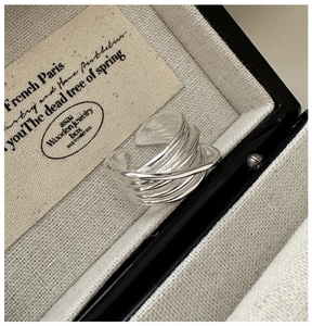 Detailed view of S925 sterling silver multilayer crossed lines adjustable ring on display