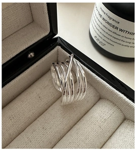 Detailed close-up of a multi-layer S925 sterling silver ring on a jewelry box liner