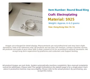 Detail of S925 sterling silver ring with triple bead charms and electroplated finish