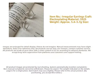 Detailed macro view of S925 sterling silver C-shape earrings with irregular texture