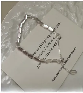 Detailed view of matte S925 sterling silver scale chain bracelet with adjustable pull bead
