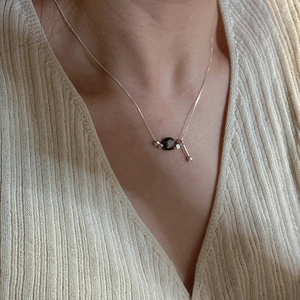 Minimalist S925 sterling silver drop necklace with dark bead and geometric metal pendant
