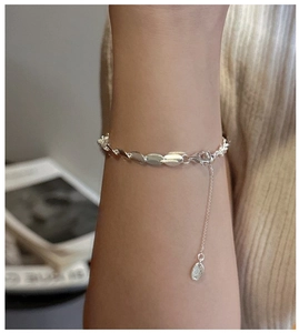 Detailed view of S925 sterling silver matte bead bracelet on wrist with adjustable clasp