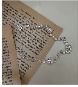 Macro detail of S925 sterling silver multilayer beaded bracelet with AG925 hallmark