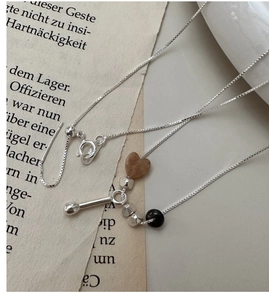 Macro view of S925 silver necklace with heart stone pendant and adjustable sliding clasp