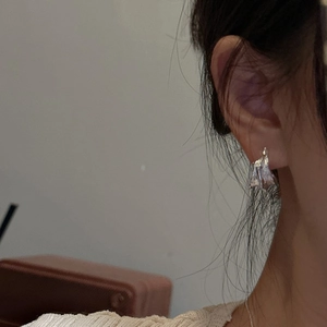 S925 sterling silver hoop earrings with irregular lava texture and minimalist wavy design