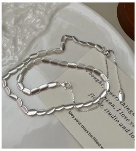 Detail of S925 sterling silver frosted bean necklace with lobster clasp and extender chain