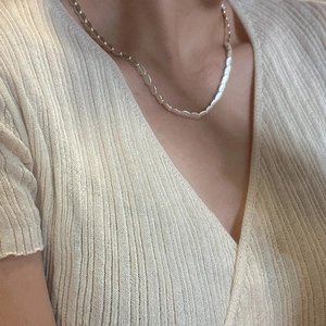 Minimalist S925 sterling silver frosted bean choker necklace worn with beige V-neck top