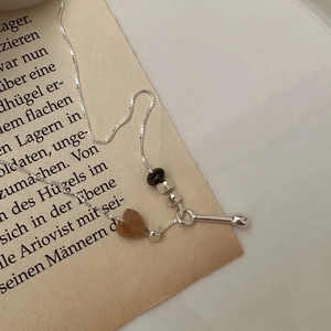 S925 sterling silver necklace featuring a heart-shaped stone and vintage drop pendant