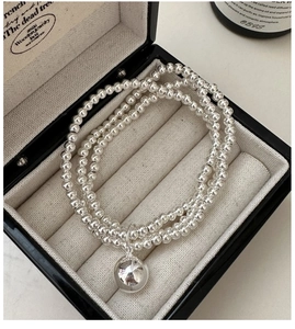 Detailed view of S925 sterling silver triple-layer beaded bracelet in a gift box