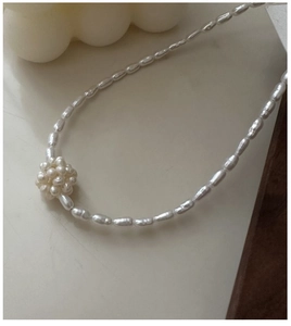 Macro detail of natural freshwater pearl necklace with 3D pearl cluster pendant