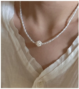 Close-up of S925 sterling silver necklace featuring delicate freshwater pearls and a center cluster