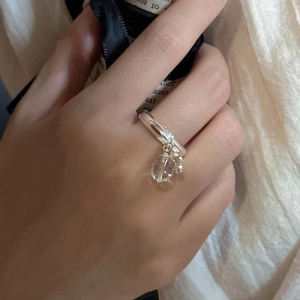 Adjustable S925 sterling silver ring with a clear teardrop crystal charm for women