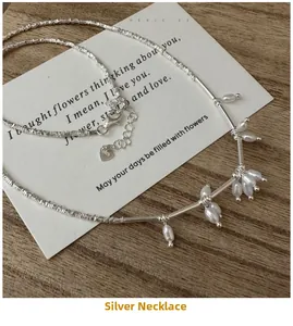 Detailed shot of S925 sterling silver nugget necklace with white freshwater pearls