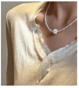 Detail of S925 silver necklace with freshwater pearl cluster pendant on model neck