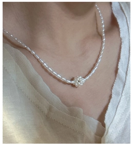 Detail of S925 silver necklace featuring irregular freshwater pearls and a central pearl cluster