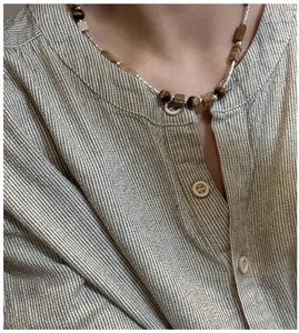 Detailed shot of S925 sterling silver beaded necklace with brown tiger eye stone beads