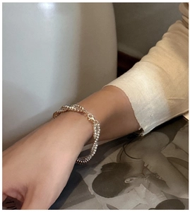 Detail of S925 sterling silver layered beaded bracelet with lobster clasp and hallmark