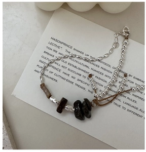 Detail of S925 sterling silver handmade bracelet with natural stones and lobster clasp