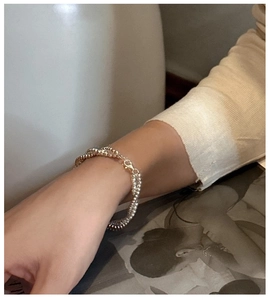 Detail of S925 sterling silver double-layer beaded bracelet on a model wrist