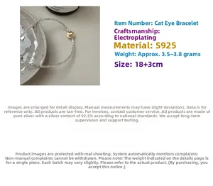 Detail of S925 sterling silver cat-eye bracelet with gold bead and crushed silver texture