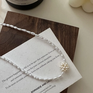 S925 silver freshwater baroque pearl necklace with floral cluster pendant on wooden tray