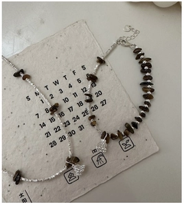 Detailed close-up of S925 silver jewelry set featuring irregular tiger eye stone beads