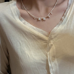 Elegant S925 sterling silver necklace with five freshwater pearl drops on model