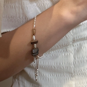 Handmade S925 sterling silver beaded bracelet featuring natural stones and adjustable cord