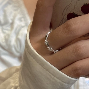 Minimalist S925 sterling silver heart chain ring shown worn on finger in a daily setting