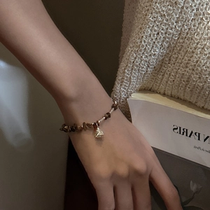 Retro S925 silver beaded bracelet with tiger eye stones and a golden flower bud charm