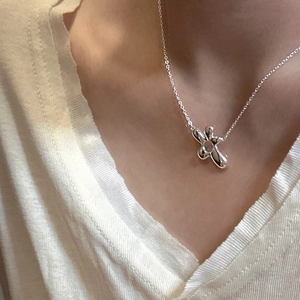 Minimalist S925 sterling silver irregular flower necklace for women shown on model neck