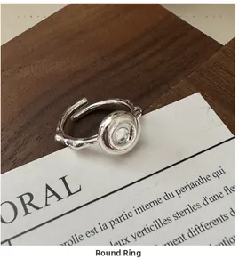 Macro detail of S925 sterling silver doughnut ring with natural branch texture