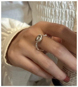 Detailed close-up of a S925 sterling silver donut ring with organic branch texture