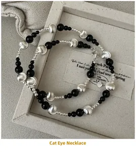Detail of S925 silver necklace featuring black onyx beads and brushed metallic textures