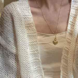 Minimalist S925 sterling silver heart pendant necklace in gold finish on female model