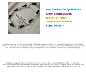 Detail of S925 silver necklace with black onyx beads and irregular metallic charms
