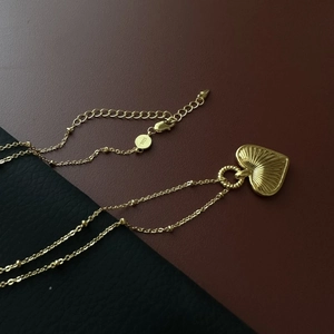 Minimalist S925 sterling silver heart necklace with sunburst texture on satellite chain
