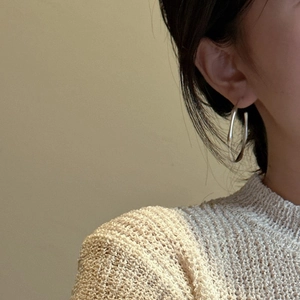 Minimalist S925 sterling silver organic twisted hoop earrings shown on a model