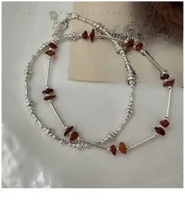 Detail shot of S925 sterling silver handmade beaded necklace with amber crystal stones