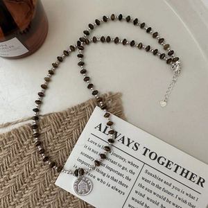 S925 silver beaded necklace with brown tiger eye stones and a vintage coin pendant